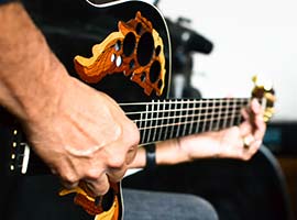 Playing an Adamas Ovation Guitar